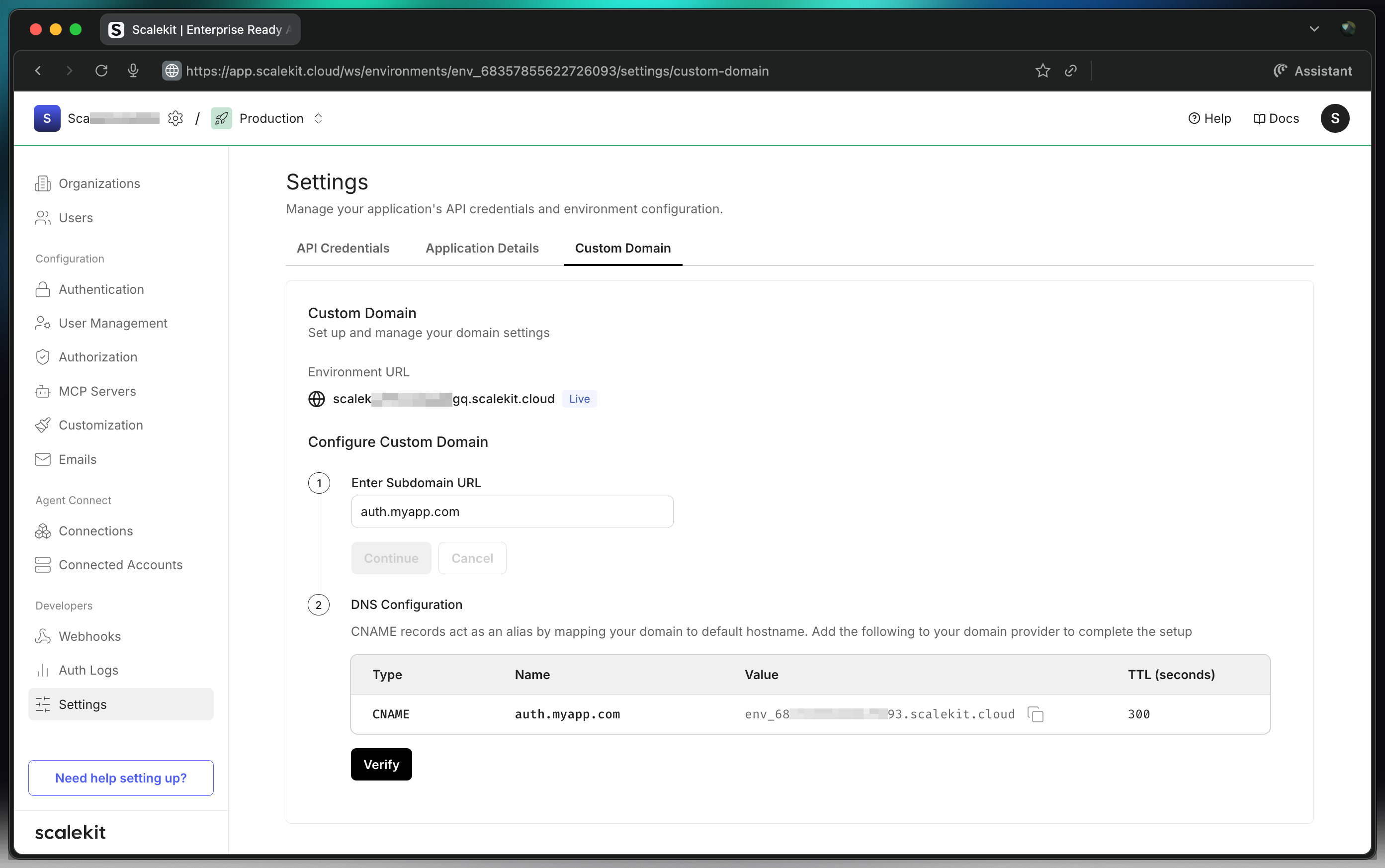 Scalekit Settings Custom Domain tab showing the subdomain URL field and a CNAME record in the DNS configuration table