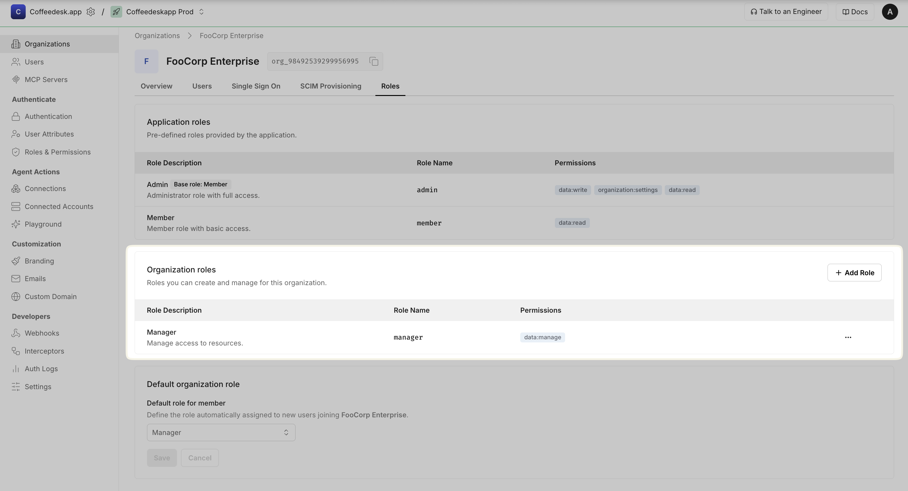 Organization Roles tab for a single organization, showing application roles, organization roles, and a default organization role selector