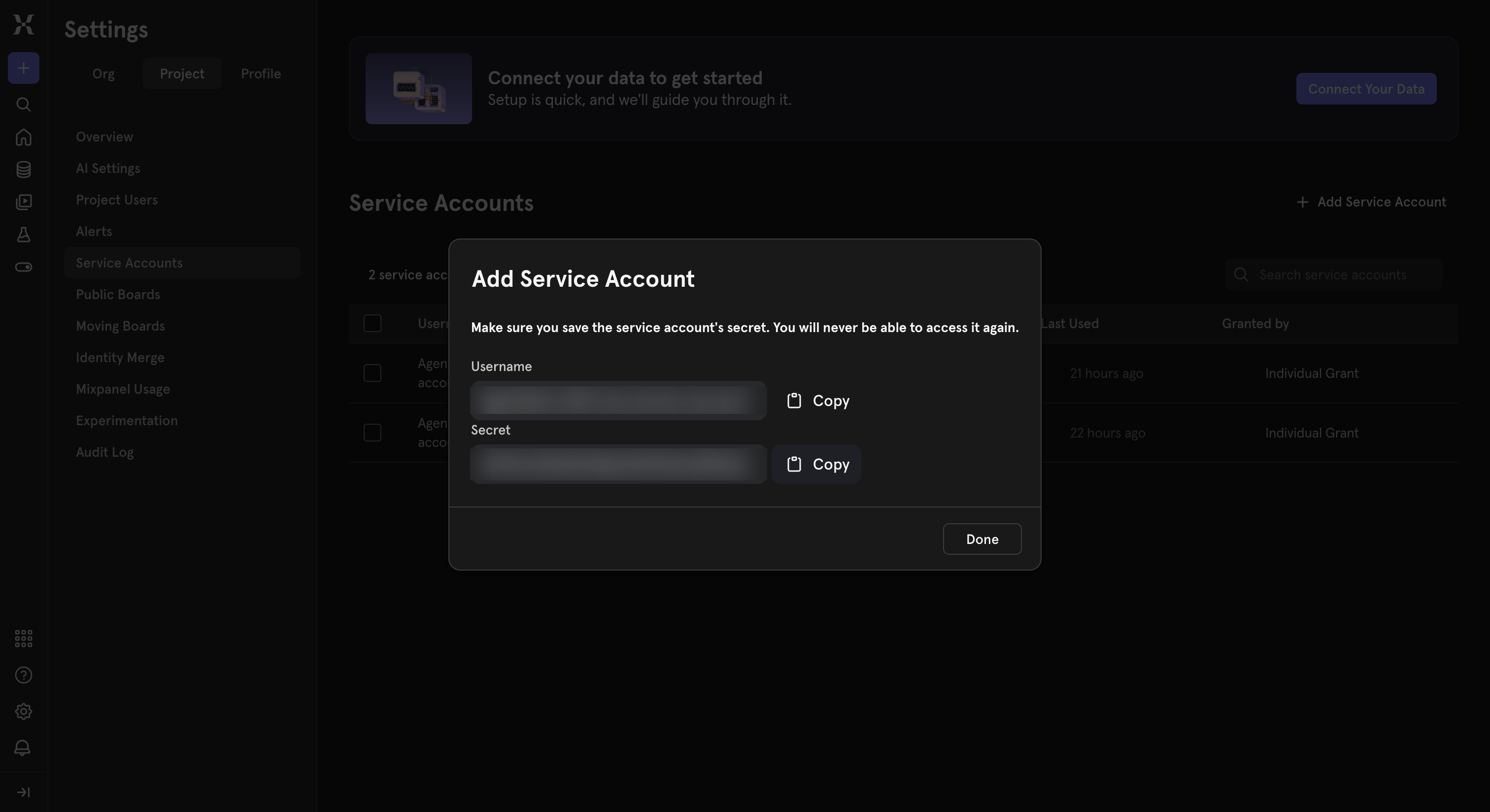 Mixpanel Add Service Account modal showing the generated Username and Secret fields